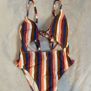 One piece open back striped bathing suit